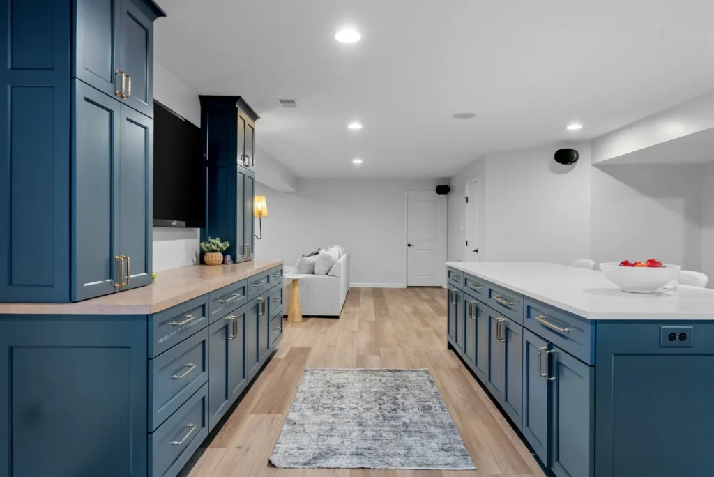 Finished basement with a custom kitchenette and entertaining space
