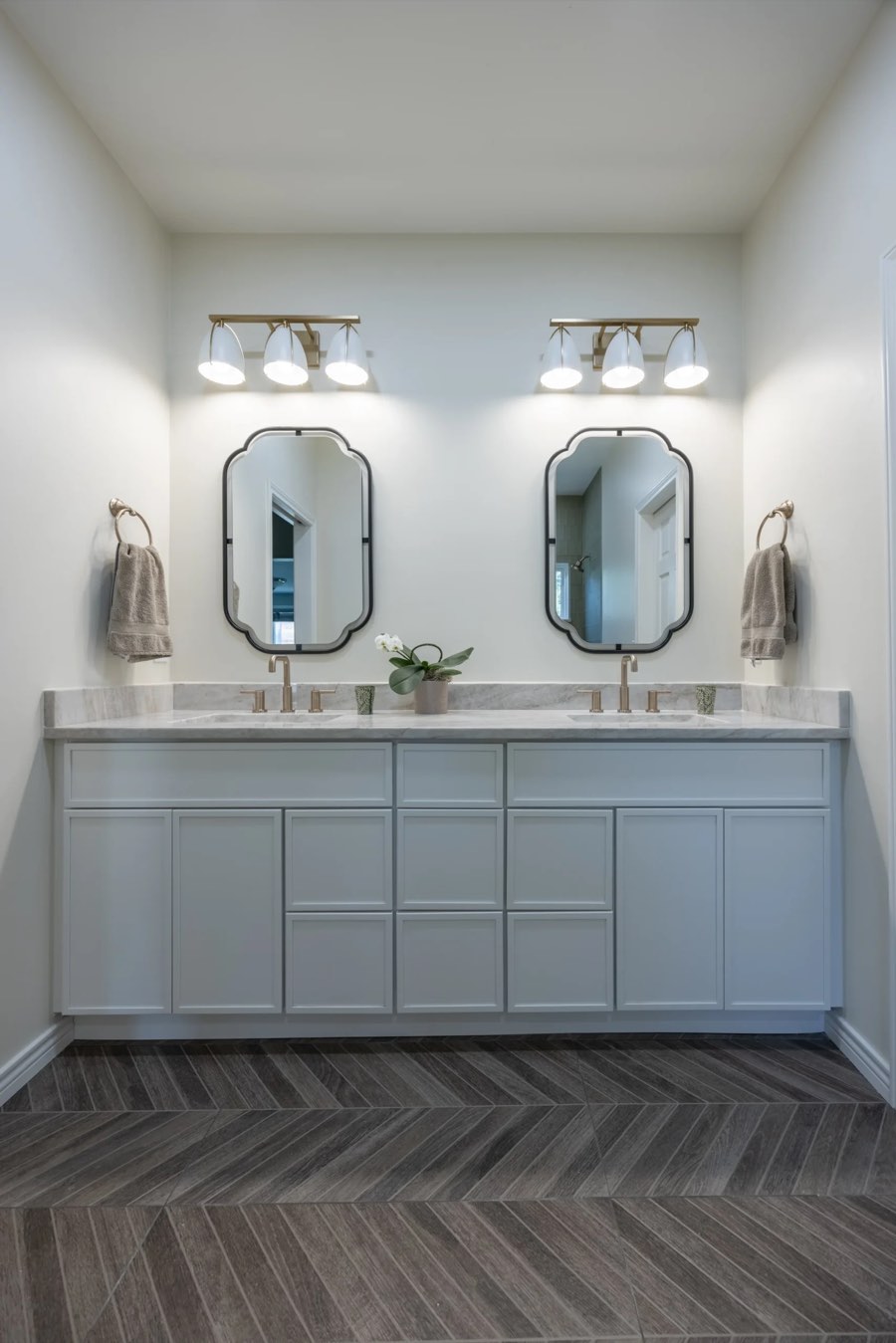 Prime Craft design-build detail featuring a double vanity with tailored storage