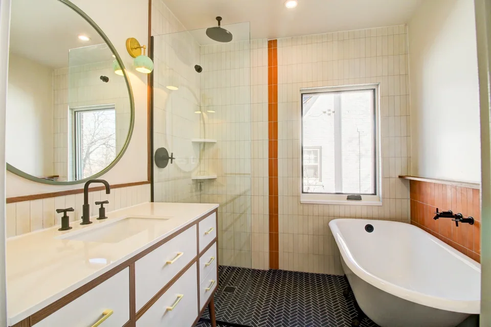Prime Craft design-build detail featuring a completed bathroom with coordinated tile and fixtures
