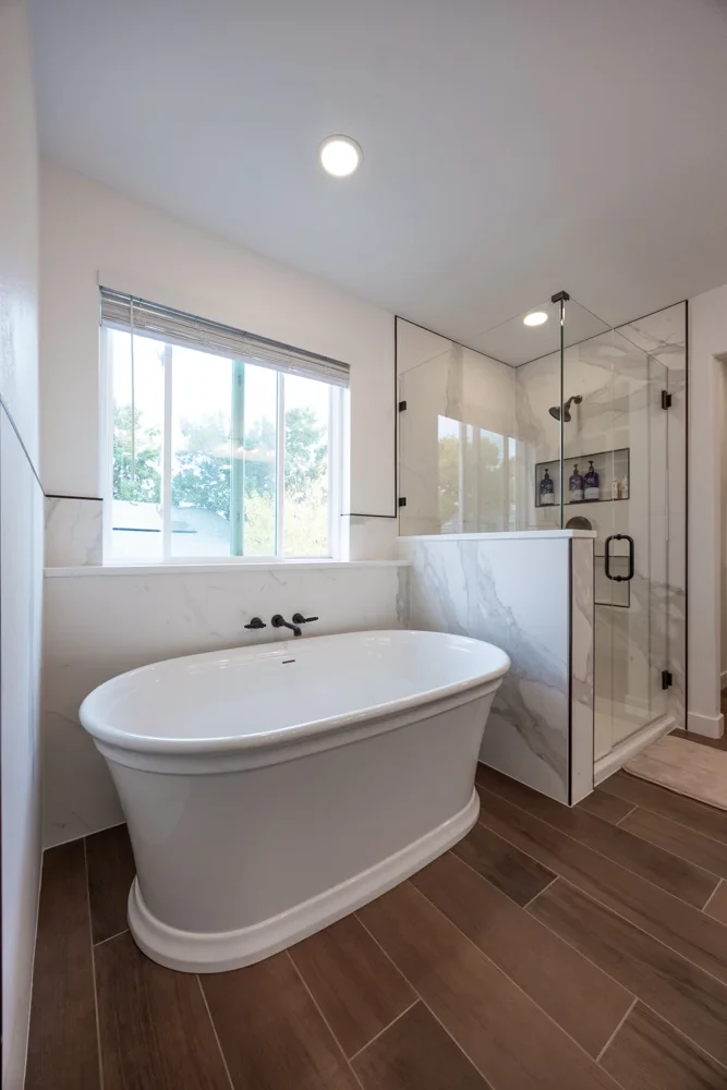 completed Prime Craft bathroom remodel in Valley Stream with freestanding tub and large-format tile